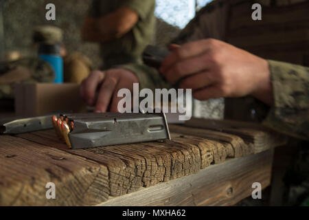 Petty Officer 3rd Class Kevin Outzen, assigned to Expeditionary Combat Camera loads mags with 9mm rounds during Fleet Combat Camera Pacific's Winter Quick Shot, Nov. 7, 2016, in Azusa, Calif. Quick Shot is a biannual exercise that provides live-fire and scenario-based training to combined joint combat camera assets. (U.S. Marine Corps photo by Lance Cpl. Brooke Woods) Stock Photo