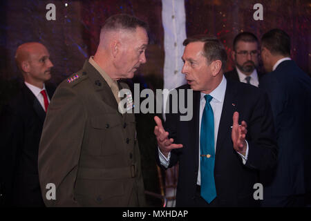 U.S. Marine Corps Gen. Joseph F. Dunford, Jr., chairman of the Joint Chiefs of Staff, speaks with retired U.S. Army Gen. David Petraeus during the 8th Annual Children of Fallen Patriots Foundation Greenwich Gala in Riverside, Conn. Nov. 12, 2016. The foundation raised over $2.5 million at the event to provide college scholarships to military children who have lost a parent in the line of duty.(DoD Photo by U.S. Army Sgt. James K. McCann) Stock Photo