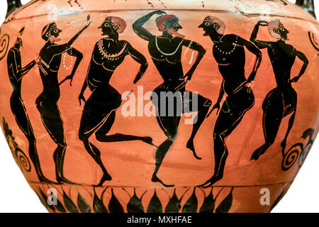 New York, USA - June 26th, 2008: Ancient greek terracotta neck-amphora with flute player and dancers. Isolated over white background. Metrop. Museum Stock Photo