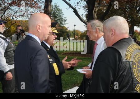 11/11/16 - Veteran's Day Event   US Army Maj. Gen. Frank Vavala, adjutant general Delaware National Guard,  and Gov. Jack Markell greet Senator Tom Carper, a Navy Veteran, before the start of the Veteran's Day celebration at the Delaware Memorial Bridge as members of all services past and present honor those who have served, in Wilmington, Del. (US Army National Guard photo by Staff Sgt. James Pernol/released) Stock Photo