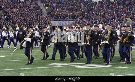 JOINT BASE LEWIS-MCCHOROD, Wash. – Soldiers from the I Corps Band march onto the field prior to the Washington Huskies and USC Trojans football game in Seattle Nov. 12. The I Corps Band performed both America the Beautiful and the Star Spangled Banner as part of UW’s Salute to Service. (U.S. Army photos by Staff Sgt. Steven Schneider, 5th MPAD) Stock Photo