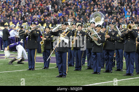 JOINT BASE LEWIS-MCCHOROD, Wash. – Soldiers from the I Corps Band perform the Star Spangled Banner alongside the University of Washington Marching Band prior to the Washington Huskies and USC Trojans football game in Seattle Nov. 12. The I Corps Band performed both America the Beautiful and the Star Spangled Banner as part of UW’s Salute to Service. (U.S. Army photos by Staff Sgt. Steven Schneider, 5th MPAD) Stock Photo