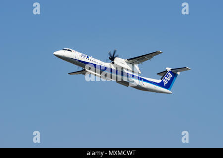 OSAKA, JAPAN - APR. 28, 2018: Bombardier DHC-8-400 Dash 8 taking off from the Itami International Airport in Osaka, Japan. Stock Photo