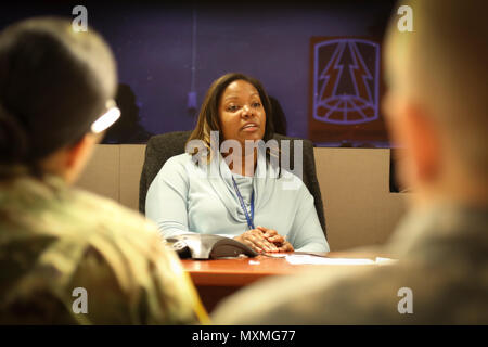 Mrs. Natasha Whitfield, PhD., a clinical psychologist with the Substance Abuse Treatment Program of the Atlanta Veterans Affairs Medical Center addresses a group of Soldiers and civilians at the 335th SC (T) headquarters Nov. 21, during a Substance Abuse Action Meeting.  The meeting provided attendees with an opportunity for two-way communication and consultation with representatives from the Atlanta Veterans Affairs Medical Center and an Alcohol and Drug Officer from the 3rd Medical Command (Deployment Support). Stock Photo