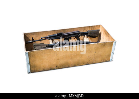 Kalashnikov assault rifles in a wooden box. Arms trade. illegal sale of weapons. An automatic weapon with a sniper scope in wood box isolated on white Stock Photo