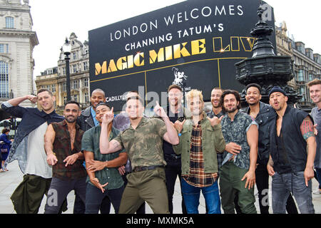 Channing Tatum (centre) with dancers from his Magic Mike Live show, in Piccadilly Circus, London, following his announcement that the show is coming to the capital. Stock Photo