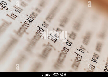 Word LIFE printed on a book paper ,macro photo ,diagonal line in focus Stock Photo