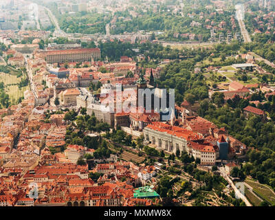 Aerial view on Prague Castle and Saint Vitus Cathedral, Czech Republic. Panoramic view from airplane in sunny day. Stock Photo