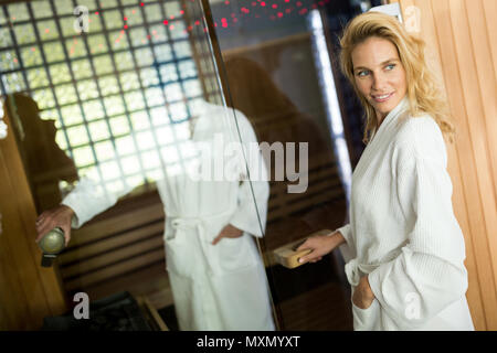 Attractive happy couple relaxing in spa center Stock Photo