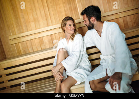 Attractive happy couple relaxing in spa center Stock Photo
