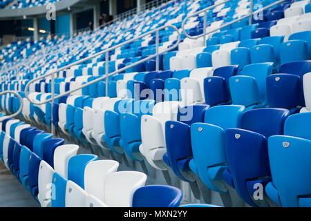 Sport stadium Plastic chairs in a row. Stock Photo