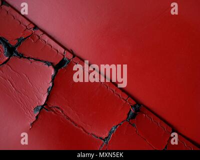 Torn vivid red leather. Stock Photo