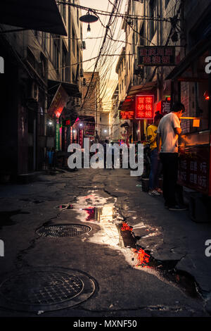 XI'AN, CHINA - MAY 14, 2018: Afternoon Sunset over a Chinese Urban Food Street Stock Photo