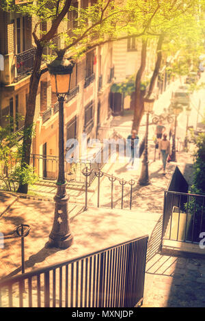 Typical Montmartre staircase and old street lamp, golden sunny light in Paris France Stock Photo