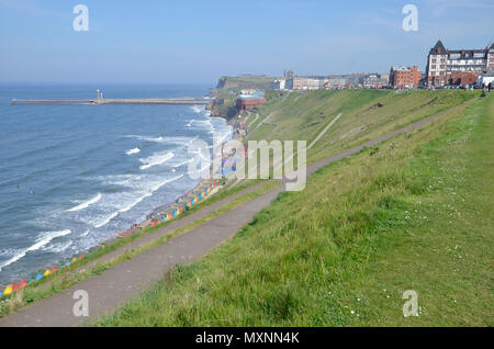 The West Cliff area of Whitby, North Yorkshire, with the piers to the left Stock Photo