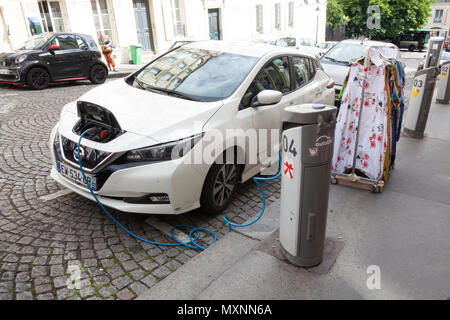 Electric car charging, Nissan leaf, Montmartre, Paris, France, Stock Photo