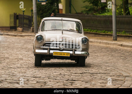 Lviv, Ukraine - June 3, 2018:Old retro car Ford T its owner and an unknown passenger taking ...