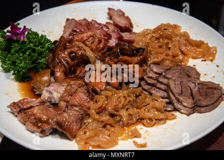 Mixed plate of jelly fish, octopus, beef and chicken at a chinese ...