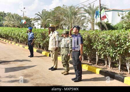 161121-N-XO783-020 DJIBOUTI, Djibouti (Nov. 21, 2016) Commander, U.S. Naval Forces Europe-Africa /Commander, Allied Joint Force Command Naples, Adm. Michelle Howard, center right, reviews the Djibouti and Somali National Police with local leadership at the Djibouti National Police Academy Nov. 21, 2016. U.S. Naval Forces Europe-Africa, headquartered in Naples, Italy, oversees joint and naval operations, often in concert with allied, joint, and interagency partners, to enable enduring relationships, and increase vigilance and resilience in Europe and Africa. . (U.S. Navy photo by Petty Officer  Stock Photo