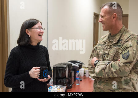 Mrs. Ricki Selva, wife of U.S. Air Force Gen. Paul J. Selva, vice chairman of the Joint Chiefs of Staff, speaks with U.S. Army Maj. Gen. John Thomson, U.S. Forces – Afghanistan deputy commander for support, at Bagram Airfield, Afghanistan, Nov. 24, 2016. Gen. Selva and Mrs. Selva visited troops across Afghanistan to spend Thanksgiving Day with them and thank them for their service. (DoD Photo by U.S. Army Sgt. James K. McCann) Stock Photo