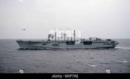 161125-N-KK394-096    ARABIAN GULF (Nov. 25, 2016) The Royal Navy ship HMS Ocean (L12) transits the Arabian Gulf alongside the USS Dwight D. Eisenhower (CVN 69) (Ike). Ike and its carrier strike group are deployed in support of Operation Inherent Resolve, maritime security operations and theater security cooperation efforts in the U.S. 5th Fleet area of operations. (U.S. Navy photo by Petty Officer 3rd Class Anderson W. Branch) Stock Photo