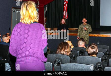 Erica Thomas presents her concern about the danger at a cross walk used by her children during the Town Hall Meeting at the base theater on  Marine Corps Air Station New River Nov. 29. The meeting was comprised of sections and shops of the Air Station who had representatives speak to the residents of Marine Corps Air Station New River and receive feedback for any goods and services available. Thomas is a resident of Marine Corps Air Station New River. Stock Photo