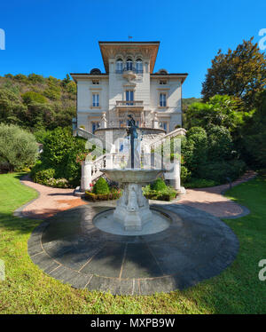 beautiful classical mansion surrounded by a park, outdoors Stock Photo