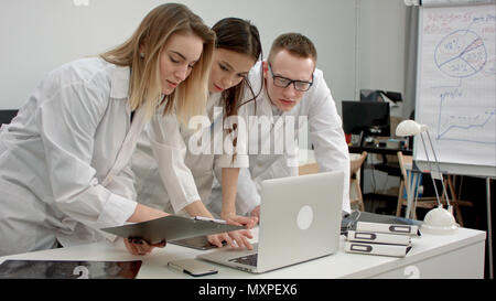 Medical doctors team using laptop in the office Stock Photo