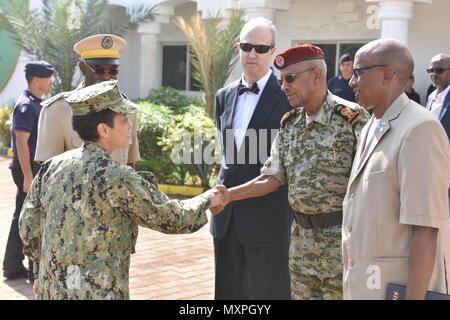 161121-N-XO783-048 DJIBOUTI, Djibouti (Nov. 21, 2016) Commander, U.S. Naval Forces Europe-Africa /Commander, Allied Joint Force Command Naples, Adm. Michelle Howard, left greets a representative from the Djibouti Ministry of Defense at the Djibouti National Police Academy Nov. 21, 2016. U.S. Naval Forces Europe-Africa, headquartered in Naples, Italy, oversees joint and naval operations, often in concert with allied, joint, and interagency partners, to enable enduring relationships, and increase vigilance and resilience in Europe and Africa. . (U.S. Navy photo by Petty Officer 2nd Class Adam Stock Photo