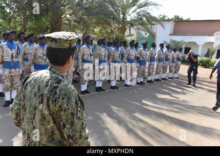 161121-N-XO783-036 DJIBOUTI, Djibouti (Nov. 21, 2016) Commander, U.S. Naval Forces Europe-Africa /Commander, Allied Joint Force Command Naples, Adm. Michelle Howard, left, reviews the Djibouti and Somali National Police at the Djibouti National Police Academy Nov. 21, 2016. U.S. Naval Forces Europe-Africa, headquartered in Naples, Italy, oversees joint and naval operations, often in concert with allied, joint, and interagency partners, to enable enduring relationships, and increase vigilance and resilience in Europe and Africa. . (U.S. Navy photo by Petty Officer 2nd Class Adam Tucker/Released Stock Photo