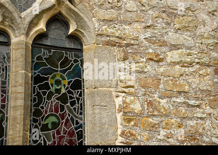 Warm coloured sandstone wall and church window. Stock Photo