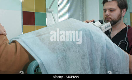 Pregnant woman at a reception at the gynecologist Stock Photo