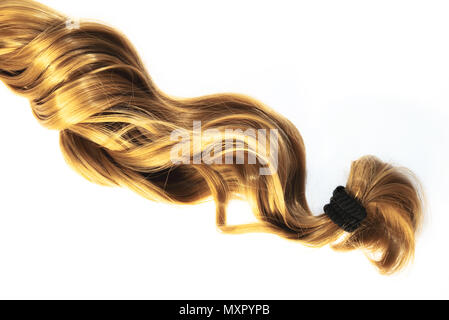 blond strand of hair on white background Stock Photo