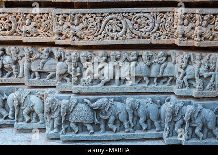 Detail from intricate exterior carvings on the lower part of the outer wall of  the 13th century Channakeshava, or Hoysalakesava, temple at Somnathpur Stock Photo