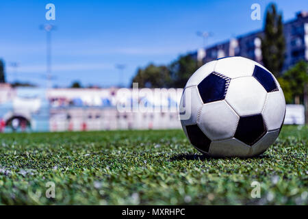 Soccer ball on grass in soccer stadium. Stock Photo
