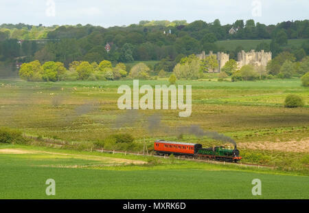 O1 Steam loco and a 'Birdcage' coach heads away from Bodiam Castle on the Kent and east Sussex Railway Stock Photo