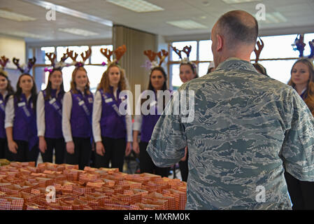 Col. Ryan Samuelson, 92nd Air Refueling Wing commander, speaks with 14 Spokane Lilac Festival Princesses during the annual Operation Cookie Drop Dec. 6, 2016, at Fairchild Air Force Base. The Lilac Princesses were joined by the Officer’s Spouses Club in packing more than 500 bags for Airmen living in the dormitories. (U.S. Air Force photo/Senior Airman Mackenzie Richardson) Stock Photo