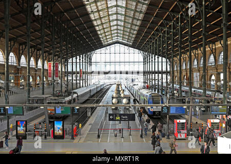 Interior view of trains waiting for passengers on track, platforms and people at the Gare du Nord train station in Paris France Europe  KATHY DEWITT Stock Photo