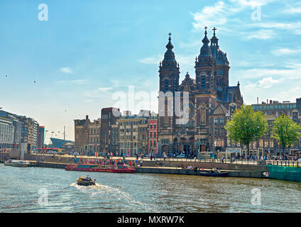 AMSTERDAM, NETHERLANDS - MAY 27: (EDITORS NOTE: Image is a digital composite.) The Basilica of Saint Nicholas (in Dutch: Basiliek van de Heilige Nicolaas) at the Prins Hendrikkade Street on May 27, 2018 in Amsterdam, Netherlands. This is the major Catholic Church of the city. Stock Photo