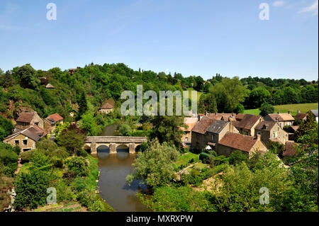 Saint-Ceneri-le-Gerei (Normandy, north-western France). The Old Bridge across the Sarthe river and the village of the Alpes mancelles region labelled  Stock Photo