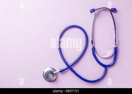 Phonendoscope on empty pink background Stock Photo