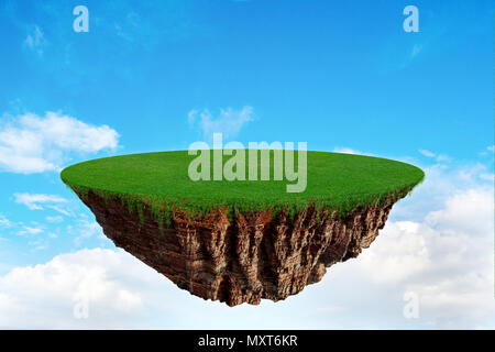 Fantasy island with green grass floating in the air on a cloudy sky. Stock Photo