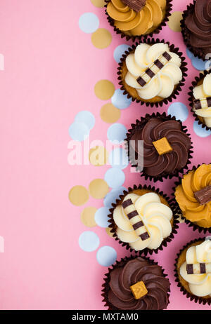 Cupcakes decorated with chocolate,caramel and vanilla icing Stock Photo