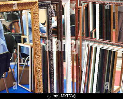 Patterned art frame for mirrors in workshop Stock Photo