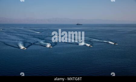 U.S. 5TH FLEET AREA OF OPERATIONS (Dec. 6, 2016) Amphibious assault vehicles with the 11th Marine Expeditionary Unit (MEU) debark from the USS Comstock (LSD 45) to conduct an amphibious assault rehearsal as part of Exercise Alligator Dagger, Dec. 6, 2016. The Makin Island Amphibious Ready Group (ARG) and 11th Marine Expeditionary Unit (MEU) will conduct amphibious operations and combat sustainment training throughout Dec. The ARG/MEU Navy-Marine Corps team is operating in the U.S. 5th Fleet area of responsibility in support of maritime security operations, crisis response, and theater security Stock Photo