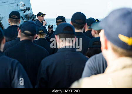 161125-N-EO381-081  ARABIAN SEA (Nov. 25, 2016) Cmdr. Paul Kaylor, commanding officer of the guided-missile destroyer USS Nitze (DDG 94), speaks to the crew during an all hands call. Nitze, deployed as part of the Eisenhower Carrier Strike Group, is supporting maritime security operations and theater security cooperation efforts in the U.S. 5th Fleet area of operations. (U.S. Navy photo by Petty Officer 3rd Class Casey J. Hopkins) Stock Photo