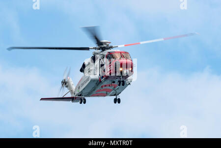Coastguard Helicopter G-MCGY on exercise with the RNLI in Mounts Bay Cornwall, UK Stock Photo