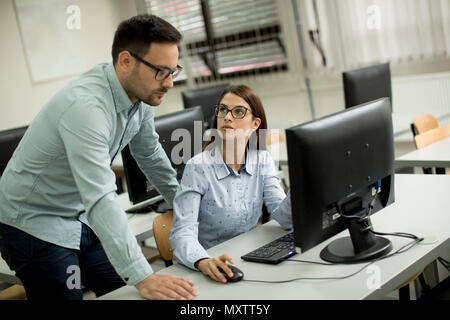 Young couple learning in the classroom Stock Photo