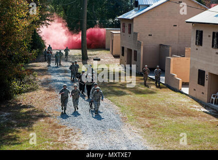 A team of medics respond to a simulated attack during an Emergency Medical Technician refresher course, Nov. 4, 2016, at Moody Air Force Base, Ga. The medics utilized the Military Operations in Urban Terrain village where they were tested on skills they’d spent the week refreshing. (U.S. Air Force photo by Airman 1st Class Janiqua P. Robinson) Stock Photo