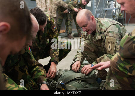 Army Master Sgt. James Roscoe representing Alpha Company, 5th Military Information Support Battalion, instructs soldiers from the Netherlands on the proper usage of MC6 and T11 equipment in preparation for Operation Toy Drop XIX. Operation Toy Drop is an annual collective training exercise used to prepare Soldiers to support the Global Combatant Commanders and Army Service Component Commanders in theaters of operation around the world. (U.S. Army Reserve Photo by Sgt. Darryl Montgomery) Stock Photo